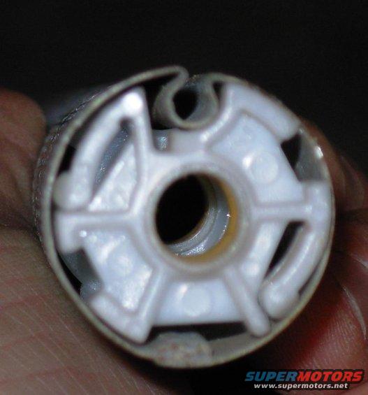 15rodbearing.jpg The bearings at the L end inside the drum is usually jammed onto its stops due to the spring pressure, but it can be driven out using the torque rod.  The one in the center usually slides freely, but the stops for the L bearing will prevent it from coming out, even if the drum is straight.