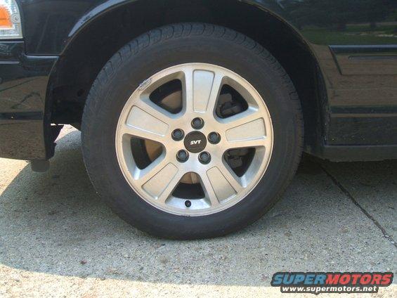 cv-svt-rims.jpg Crown Vic SVT rims I made using SVT Mustang centercaps and black-oxide coating the stock lug-nuts.