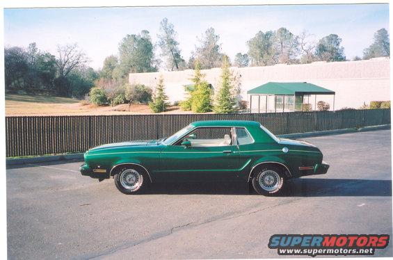 scan0001.jpg Here in a new picture on my 77 Mustang with new wheel centers