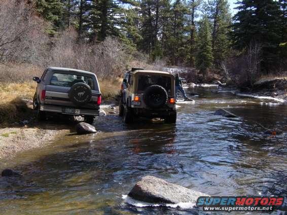 river_crossing.jpg End of the China Wall Trail in Colorado. Mine is the vehicle on the left, of course.  Got stuck getting out of this little stream after playing for awhile.