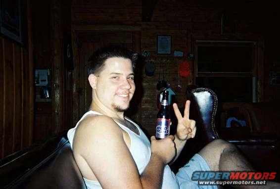 hunt19.jpg Me drinking, and showing me how much we came home with.....two empty coolers.