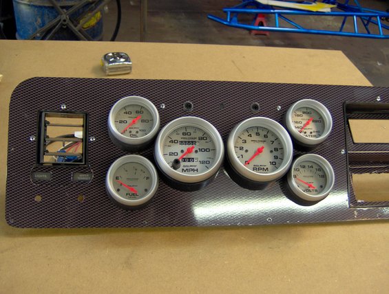 135.jpg here is the dash covered in carbon-fiber