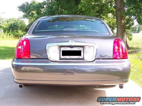 100_2667res6.jpg Rear end pic w/ my color matched painted SCT emblem and my recently added Cartier trunk emblem.  Exhaust tips are just cheap chrome tips from AutoZone.