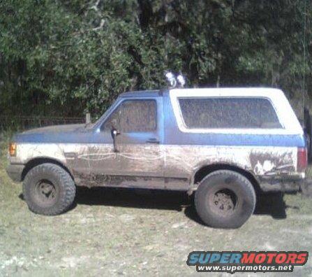 bronco-mudd-2.jpg after i put 33"s on it and 15x10" rims beleve it or not i have less tha 50buck in all 5 tires and rims (perks of working at a junk yard at the time) also u can see the light bar i built out of an old bumper and a fence post