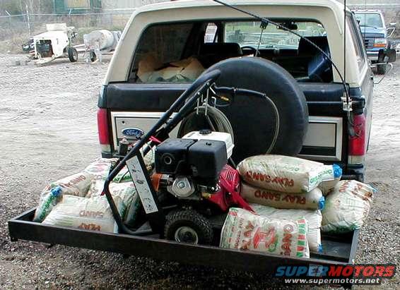 sandbags.jpg I think it's about 800lb of cargo because each of the 13 sandbags weighs 50lb.  The hitch hauler itself is another ~100 lb, so that's close to 1/2 ton, not including the bumper & whatever's in the truck.

[url=http://www.supermotors.net/registry/media/77642][img]http://www.supermotors.net/getfile/77642/thumbnail/steve-jump-1.jpg[/img][/url] . [url=http://www.supermotors.net/registry/media/576601][img]http://www.supermotors.net/getfile/576601/thumbnail/hhiso.jpg[/img][/url] . [url=http://www.supermotors.net/registry/media/65146][img]http://www.supermotors.net/getfile/65146/thumbnail/on_the_job.jpg[/img][/url] . [url=http://www.supermotors.net/registry/media/65160][img]http://www.supermotors.net/getfile/65160/thumbnail/trim_panel.jpg[/img][/url] . [url=http://www.supermotors.net/registry/media/518284][img]http://www.supermotors.net/getfile/518284/thumbnail/hitchhaulerdirt.jpg[/img][/url] . [url=http://www.supermotors.net/registry/media/746567][img]http://www.supermotors.net/getfile/746567/thumbnail/03frigtires.jpg[/img][/url] . [url=http://www.supermotors.net/registry/media/165601][img]http://www.supermotors.net/getfile/165601/thumbnail/15-loaded.jpg[/img][/url] . [url=http://www.supermotors.net/registry/media/168078][img]http://www.supermotors.net/getfile/168078/thumbnail/crate-14.jpg[/img][/url]

UPDATE 9/8/15 : I did it again with 13 100# bags of industrial quartz sand.

[url=http://www.supermotors.net/registry/media/1067150][img]http://www.supermotors.net/getfile/1067150/thumbnail/sands.jpg[/img][/url]