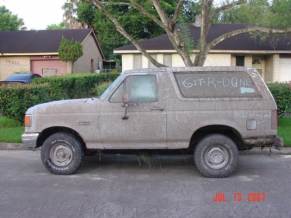 dirt-paint-job.jpg After wheeling it and being stuck a few times. Those are not weeds under the Bronco, those are trophies.