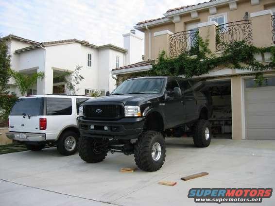 2img_0122.jpg 2003 Black Limited 4x4 Excursion with 6.0 Diesel.  14" Custom Leafs, 40" Hawgs, 16.5x12 Welds, Donahoe Nickel Plated Dual Shock Setup, Bilstein 7100 shocks, Kodiak Steps, High Angle CV Drive Shafts, Firestone Air Bags, on the way-ORU Cross Over Steering