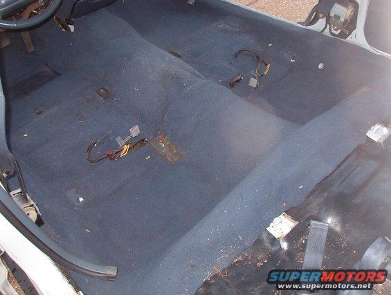 carpet01.jpg The more I looked at the carpet, the less I liked what I saw.  This is AFTER I hauled out several handfuls of garbage.  I had to pull the L threshholds, L lower B-pillar cover, & back seat to run the fuel door wire, so it's not a whole lot more work to get the carpet out.