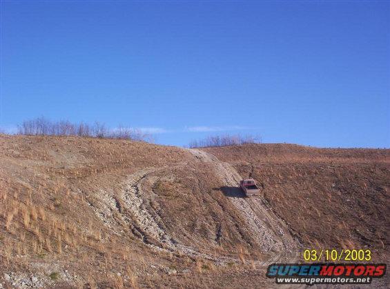 100_0059-(medium).jpg Picture 1 of 4 of me climbing a hill on an old strip mine near where I live. This hill is kind of steep but it really isn't all that bad compared to some of the other spots here.