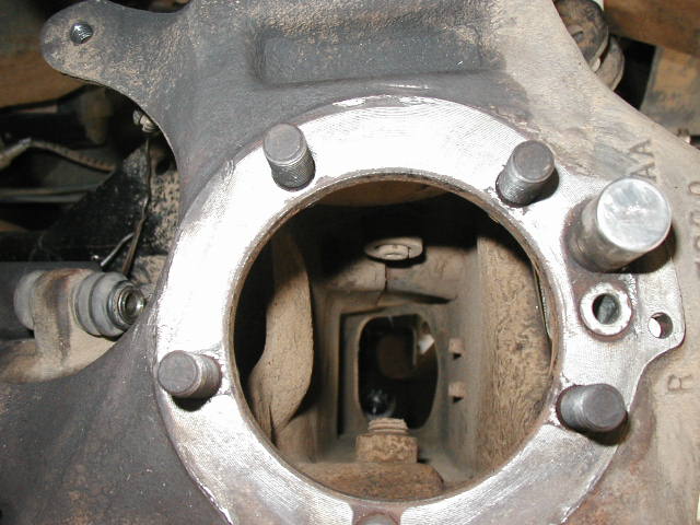 p1010065.jpg looking down through the knuckle (spindle removed and axleshaft out).  Note the ABS senso on the right of the knuckle bolt pattern.