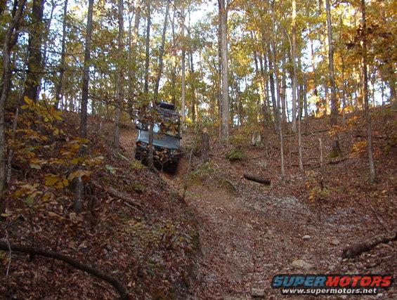 jaagdedge1.jpg This trail has some extreme hillclimbs & descents, in VERY tight trees, ending with a long, slick, rutted rocky ascent that took out 2 Discos last time - Greg's and Dennis'.  According to BJ (the manager), it's the only recovery in the park's history that required the bulldozer.

But we made it this time without damage - just some log-jamming & a little winching.