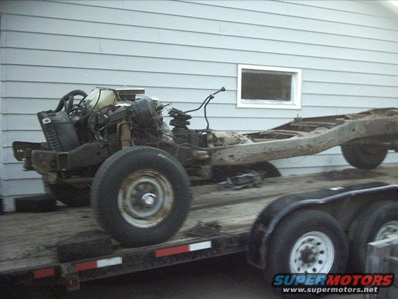 54-build--113009-015.jpg 11-30-09:   Once I got the firewall/cowl area cut down to a manageable size I pulled shifter boots and transmission inspection cover off the floor pan. Then I unbolted 3 of the 4 cab body mount bolts. I couldn't break the 4th body mount bolt loose so I had to cut it. Then it was finally time to lift the floor off the chassis! 

And finally here is the chassis that the 54 body is going on. I'm going to cut out 45" to shorten the wheelbase to the stock 54 F100 wheelbase of 110". 