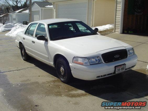 2003cvpi.jpg After a few cosmetic changes. Swapped out chrome grille for black honeycomb grille, and slapped on some center caps.