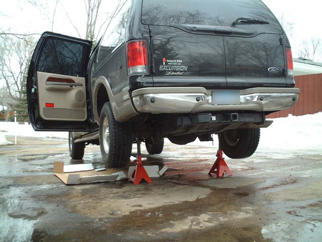 dscf0004.jpg Jack your Excursion up like this in the rear.  You will need tall jackstands that can support the weight of the vehicle.  Do not do work on your excursion without jackstands supporting the vehicle.