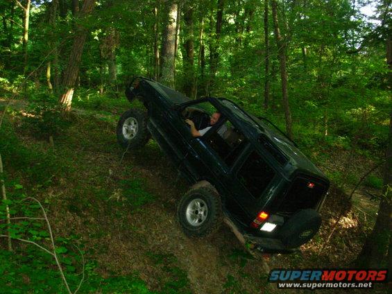 10061228teeter.jpg This was in the hole during the first attempt to go R of the tree, with the front tire about a foot in the air.