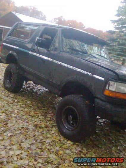 muddy.jpg still had the 33's on her, got her stuck in the pond behind my house and had to drag her out with the tractor