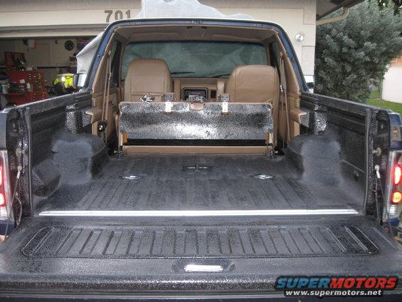 diy-bedliner-w-drings-and-customized-side-panels-(2).jpg Finished.  Getiing ready to put the top back on.....