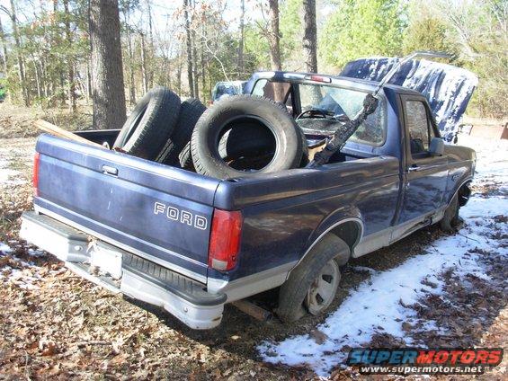 00junker.jpg What a beauty!  All those used tires in the bed WERE in the cab a few minutes ago.  Yes, the back window has been busted out for a few months.