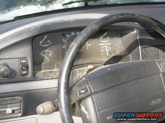 06cluster.jpg It looks like birds were roosting on the dash & crapping on the column due to the broken rear window.