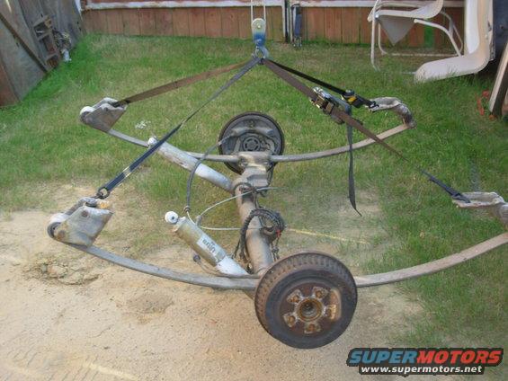 05axle.jpg This cost less than $100, which is less than a cheap trailer axle alone.  This one includes brakes, springs, bolts, hubs, shocks...