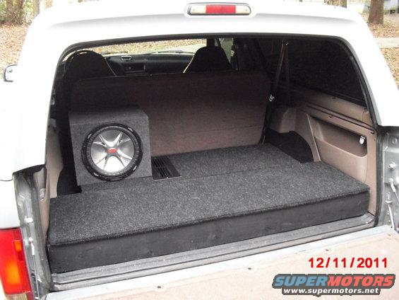 cimg7265.jpg The finished product with lids carpeted and subwoofer in place; note the cooling vent in the amp compartment lid