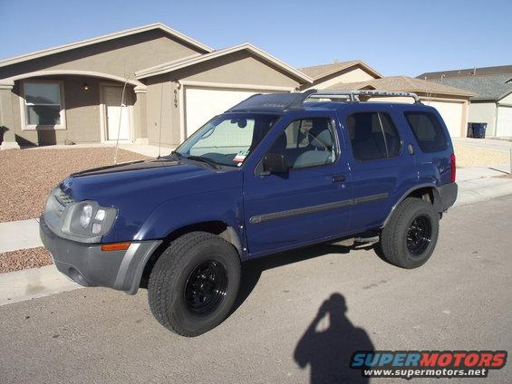 xterra-22-jan-11.jpg Side view with new Pro Comp wheels and center caps.