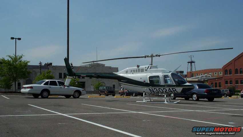 vic-helicopter50.jpg My P71 and the Colonel's, guarding a Bell helicopter for an upcoming show. 