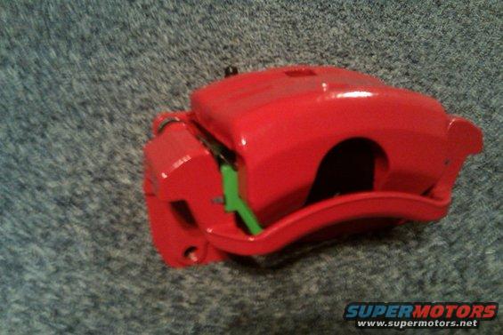 022.jpg Red powder coated, rebuilt Mazda6 calipers loaded with green stuff brake pads.