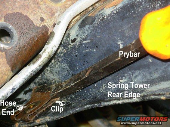 hoseclipf2.jpg Brake Hose Clip Removal

The clip can't be removed until the brake line & inverted flare nut are gone.  Pry the clip up and off; two prybars may be required.  If necessary, hook into the back of the clip to pull it off while holding the front up.

Go to the NEXT...