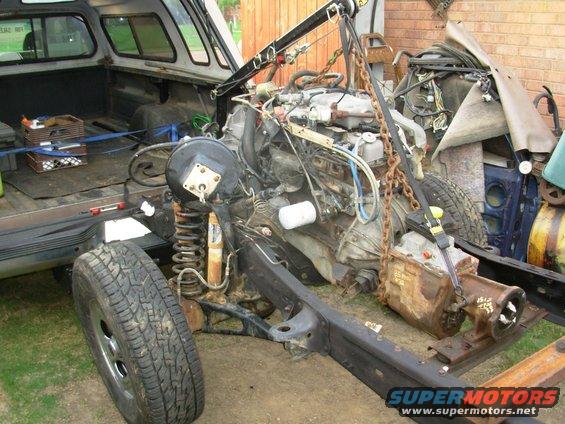 07enm.jpg The trans crossmember is the old '83, but I'm not sure if it's gonna work.  I just haven't found the newer style yet.

The 2x4 tube on the frame behind it will eventually become a new xmbr for the aux.batt. & traction bar.

[url=http://www.supermotors.net/registry/22771/78471-2][img]http://www.supermotors.net/getfile/901056/thumbnail/24hoisted.jpg[/img][/url]
