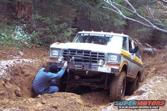 dcp_0393.jpg Tony on the big hill at top of Firebreak Five.  Uh oh!  Something went pop and I'm pretty sure it wasn't a weasel.  Tim checks out the damage and collect broke axle u-joint parts.  (11/08/2003)