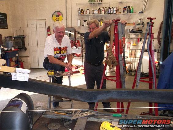 dscf02961.jpg A couple of good friends & very talented chassis builders that live close to me & are helping get the chassis set up. Ralph Wright (lt) & Kelley Greene (rt) discuss the next part of the mock-up. Picture taken at Kelley's shop where he has a surface jig for setting up a frame. We are down to welding in the rear 4 tri-bar system now.