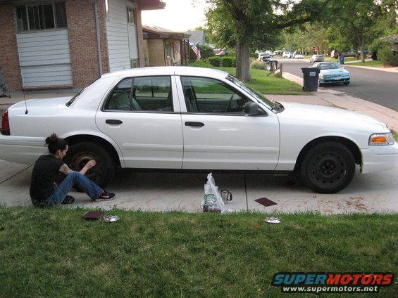 021.jpg just bought it still white Wife and I sanding the wheels to repaint em nice and shiny black.