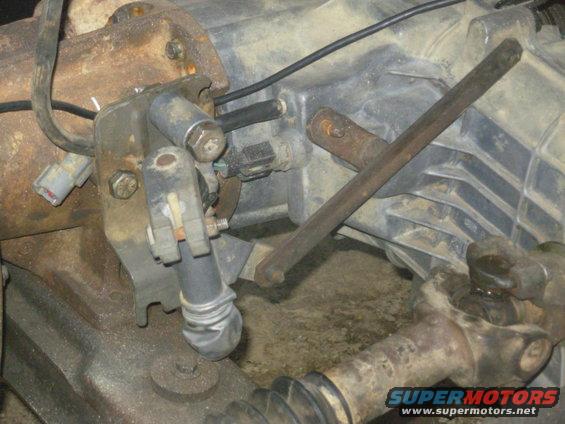 18shifter.jpg With a shorter bolt, the later shifter fits reasonably well on the early transmission extension.  The link bar will have to be custom-made.

[url=https://www.supermotors.net/registry/media/964674][img]https://www.supermotors.net/getfile/964674/thumbnail/28shifter.jpg[/img][/url] . [url=https://www.supermotors.net/registry/2742/80076-4][img]https://www.supermotors.net/getfile/936962/thumbnail/tclocs.jpg[/img][/url]