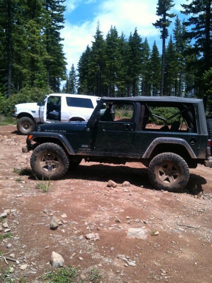 img_0935.jpg A pic of my RUBI Unlimited just out of the trail with Alvey's Bronco in the foreground. 