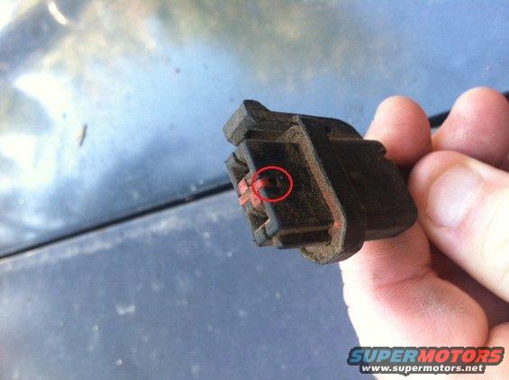 ford-harness-connector.jpg This is a typical underhood/chassic Ford harness connector. It's made up wires, a rubber weather-tight piece, the plastic connector, and a red plastic keeper.

Tools needed - preferably a small pic, but a tiny flat-head screwdriver will work, also.

Step 1 is to remove the keeper. You will notice there is small slot (circled). Place your pic in the slot and push the keeper loose. Your connector may have more than one keeper. Be careful, because the keeper may shoot off somewhere. 