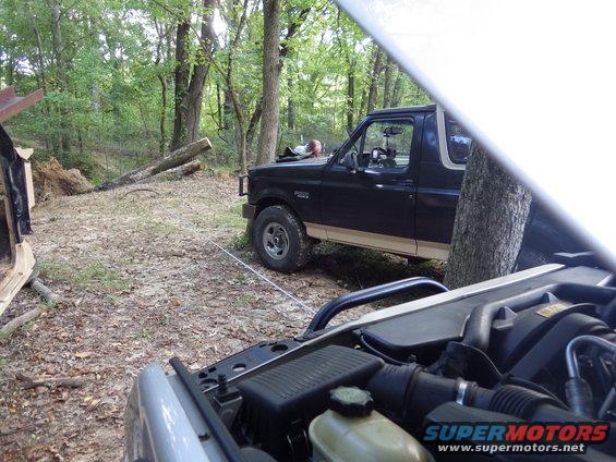 14lined.jpg Once I got set, it wouldn't budge at all, probably because I was already on the 3rd layer of cable on the drum.  So to make it roll, Greg hooked up his 12K winch to a high point on the stump, and we put a half wrap around the trunk.